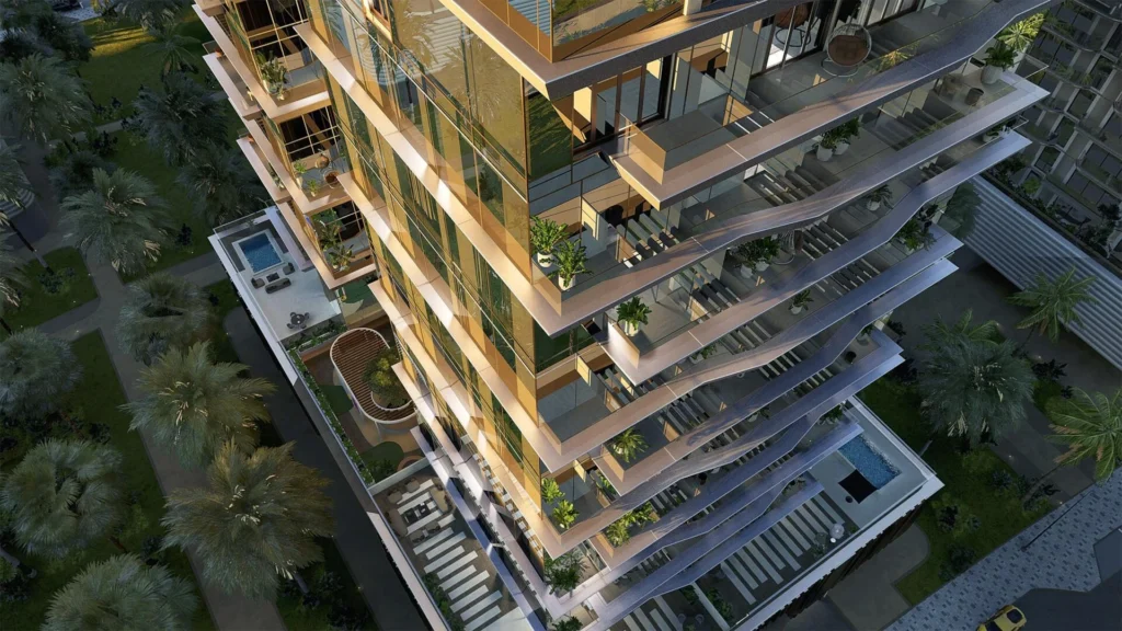 Gold-glazed boutique Dubai tower with planted terraces rooftop pool and palm gardens aerial — Dubai freehold properties for foreigners
