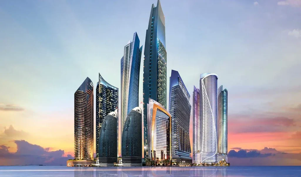 DAMAC Dubai tower cluster composite render at dusk with illuminated skyline — Dubai investment properties