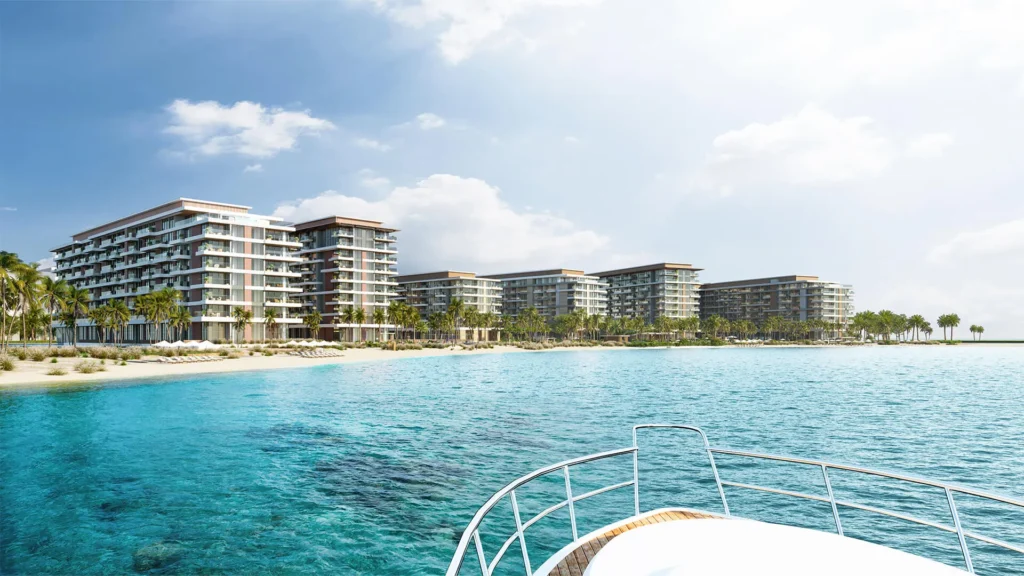 Dubai Islands beachfront low-rise residential buildings from yacht with turquoise water — Dubai investment properties